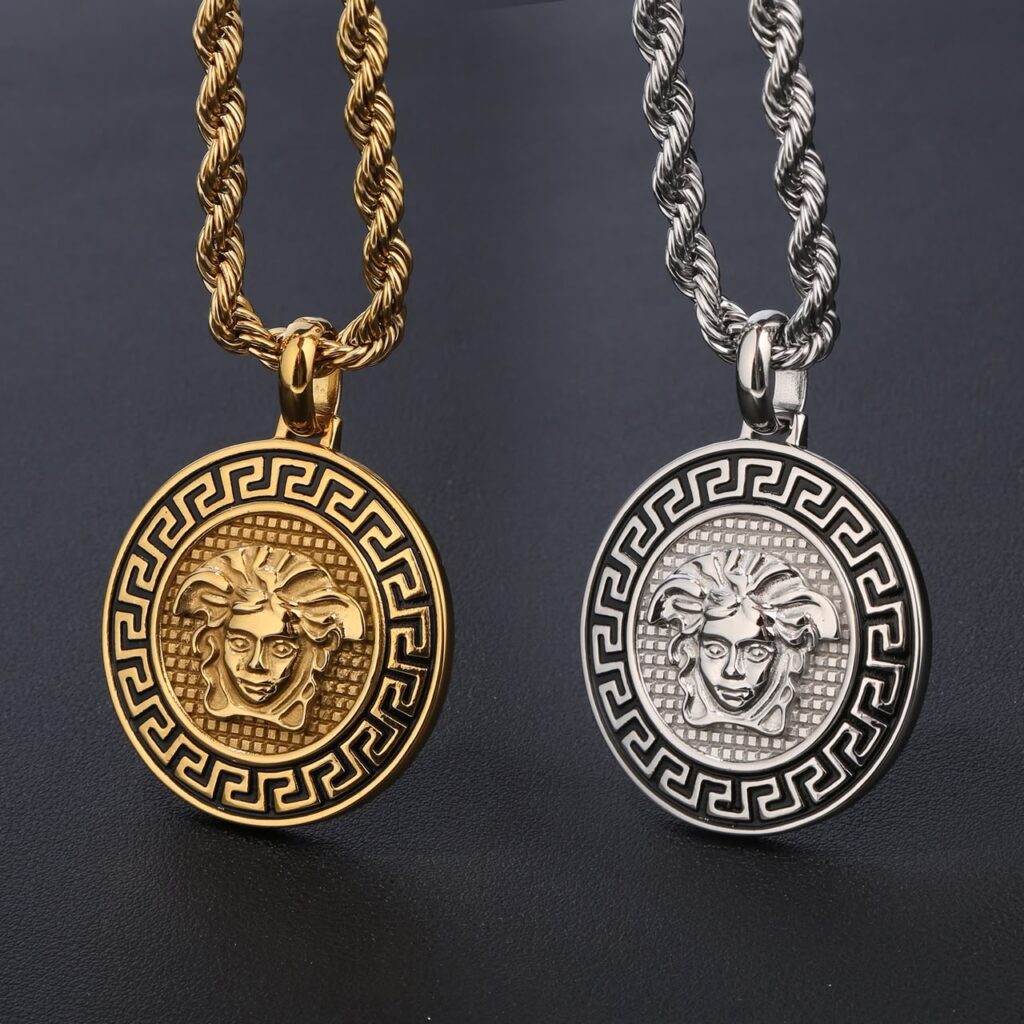 Gold and silver Zayna rope necklace pendants on dark background