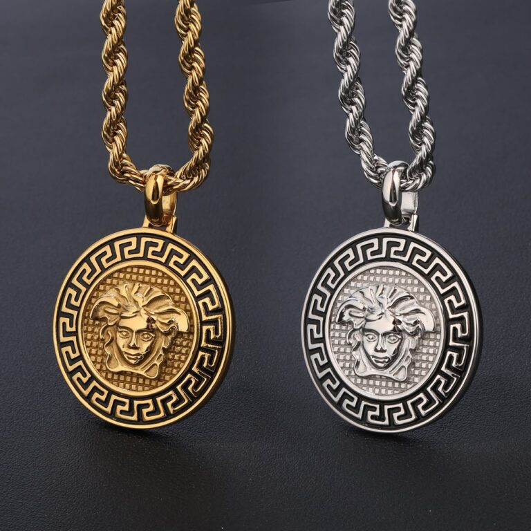 Gold and silver Zayna rope necklace pendants on dark background